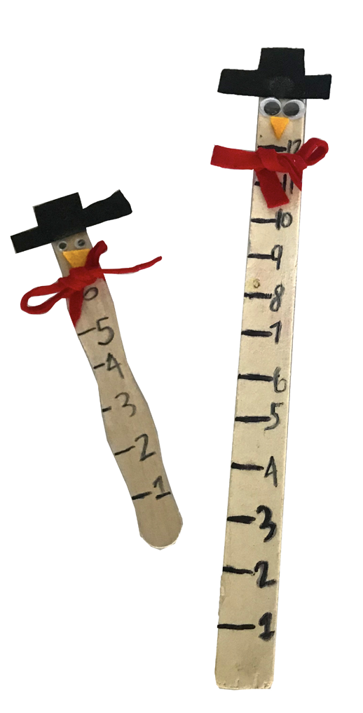 Two craft sticks with ruler markings and faces with top hats and red bow ties.